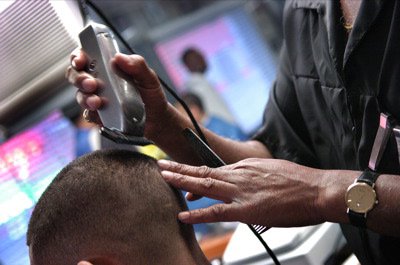 Archival close-up of a barber working with clippers